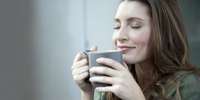 Caucasian woman drinking coffee