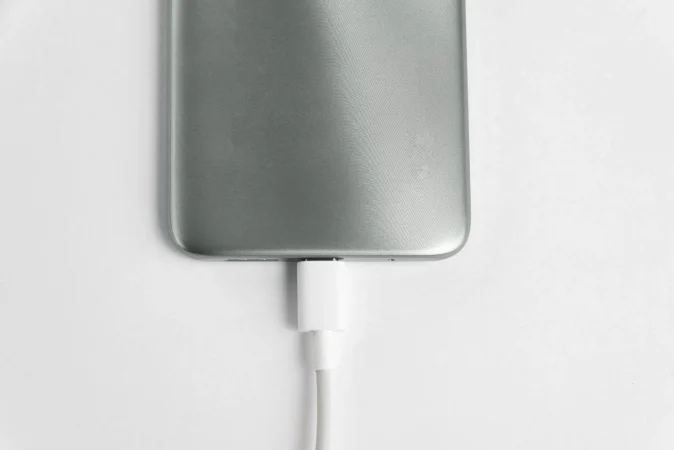 grey cell phone connected usb cable type c charging Merca2.es