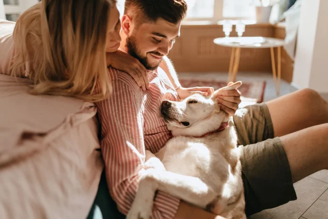 Dog Lies Legs Owner Man Pink Shirt His Beloved Woman Admire Their White Pet